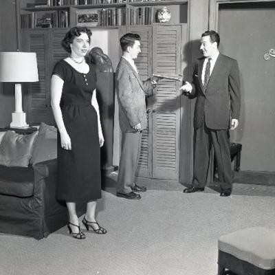 A black and white photograph of three actors on the set of Bell, Book and Candle, courtesy of the University of Akron's Archives and Special Collections.