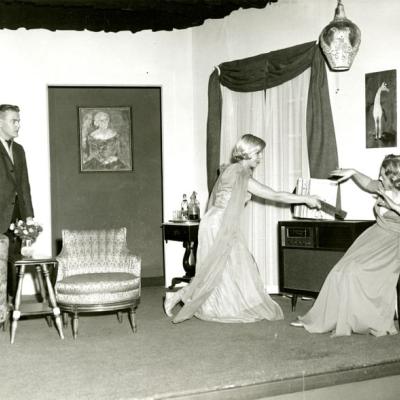 Black and white photograph of three of the actors of Blithe Spirit on the set, courtesy of the University of Akron's Archives and Special Collections